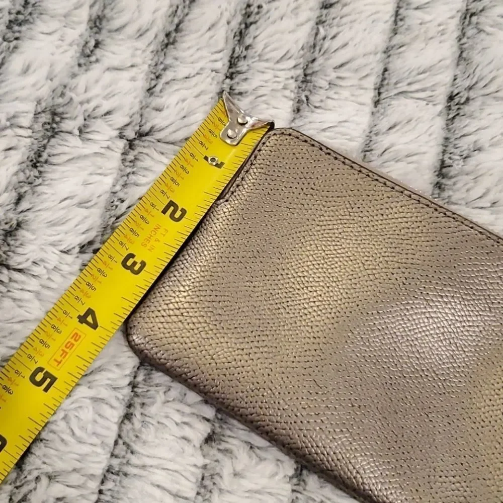 Cute metallic Coach bow wristlet